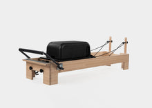 Load image into Gallery viewer, Sitting Box Lite on Studio Reformer. | caption::Sitting Box Lite on Studio Reformer