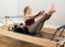 Load image into Gallery viewer, Women using Baby Arc West Coast Style on a Studio Reformer