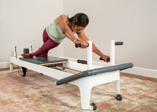Load image into Gallery viewer, Pilates professional using Plank Bars for exercises