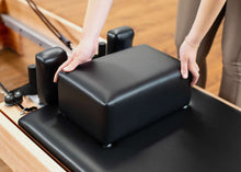 Load image into Gallery viewer, Pilates moon box being placed on a Studio Reformer