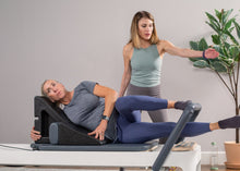 Load image into Gallery viewer, side lying exercises on pilates angle