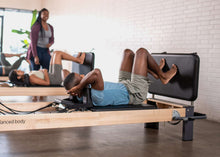 Load image into Gallery viewer, padded jumpboard on rialto reformer - pilates class