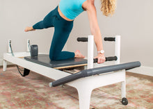 Load image into Gallery viewer, Pilates professional using Plank Bars for exercises
