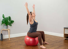 Load image into Gallery viewer, Burst Resistant Fitness Ball in use - red