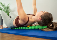 Load image into Gallery viewer, Spinefitter Trigger Tool used on Spinefitter Mat workout