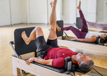 Load image into Gallery viewer, pilates studio reformer with padded jumpboard| caption::Revo Footbar