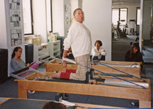 Load image into Gallery viewer, A uniquely designed reformer named after Pilates legend Ron Fletcher. | caption::Pilates Elder Ron Fletcher