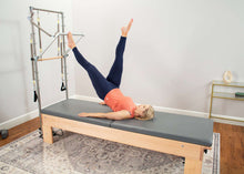 Load image into Gallery viewer, Pilates Studio Reformer with tower mat in use