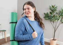 Load image into Gallery viewer, Women carrying green Ecowise flat mat on shoulder