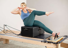 Load image into Gallery viewer, Cotton footstrap for pilates reformer exercises in use | caption:: Short Footstrap on Clinical Reformer