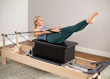 Load image into Gallery viewer, Woman using Large Sitting Box for Pilates exercises - on balanced body reformer
