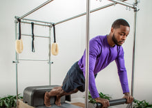 Load image into Gallery viewer, Man using the reformer trapeze combination | caption::Shown in Greystorm Upholstery