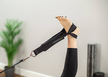 Load image into Gallery viewer, Close-up of tri-loops in use for foot stretching exercise.