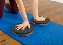 Load image into Gallery viewer, Woman using a rotator disc pad.
