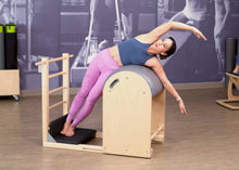 Load image into Gallery viewer, Balanced Body Ladder Barrel with Padded Foot Plates and Woman Doing Side Bend