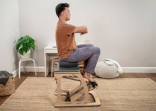 Load image into Gallery viewer, Man engaging in a dynamic workout routine using a Balansit cushion.