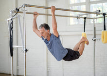 Load image into Gallery viewer, Cadillac-style Pilates equipment with multiple spring tensions and exercise options