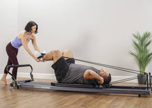 Load image into Gallery viewer, Working out on Allegro® Stretch Reformer product photo