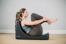 Load image into Gallery viewer, Pilates Professional exercising on C Shaper
