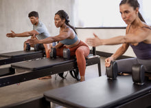 Load image into Gallery viewer, Anniversary Allegro® 2 Reformer Extended Head End Platform in use
