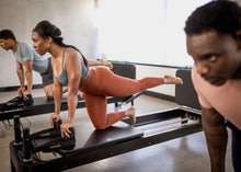 Load image into Gallery viewer, Padded Jumpboard for Anniversary Allegro® 2 Reformer in use
