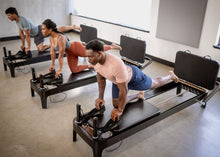 Load image into Gallery viewer, Padded Jumpboard for Anniversary Allegro® 2 Reformer in use
