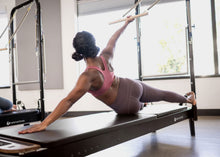 Load image into Gallery viewer, Anniversary Allegro® 2 Reformer with Tower and Mat in use

