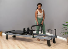 Load image into Gallery viewer, adjusting the infinity footbar on the allegro nextgen reformer
