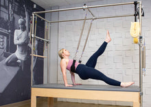Load image into Gallery viewer, Balanced Body Trapeze Stability Sling in use - woman exercising 
