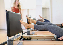Load image into Gallery viewer, padded jumpboard on rialto reformer - pilates session
