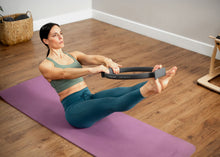 Load image into Gallery viewer, Balanced Body Flex Ring Toner with Handle Pads in use
