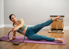 Load image into Gallery viewer, Balanced Body Flex Ring Toner with Handle Pads in use
