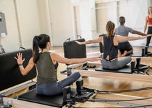 Load image into Gallery viewer, padded jumpboard on rialto reformer - in use
