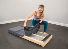 Load image into Gallery viewer, Pilates professional placing cover over CoreAlign
