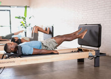 Load image into Gallery viewer, padded jumpboard on rialto reformer - pilates session - for men and women

