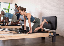 Load image into Gallery viewer, padded jumpboard on rialto reformer - pilates exercise
