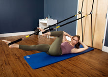 Load image into Gallery viewer, Woman using Tower on the Go in a bedroom for leg work
