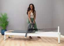 Load image into Gallery viewer, Adjusting the infinity footbar on Allegro 2 Reformer
