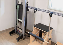 Load image into Gallery viewer, Allegro Reformer store in upright position in a studio | caption::Allegro Reformer stored upright
