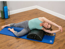 Load image into Gallery viewer, Woman stretching across East Coast Style Baby Arc on blue mat.
