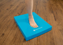 Load image into Gallery viewer, Individual doing a single leg stand on a blue pad.
