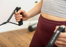 Load image into Gallery viewer, Woman holding two SoftTouch Polypro Handles.
