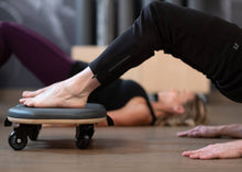 Load image into Gallery viewer, Person executing a Supine Abdominals exercise on an Orbit.
