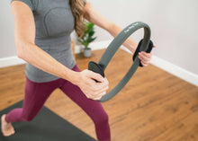 Load image into Gallery viewer, Woman utilizing Flex Ring Toner Handle Pads for upper body workout.
