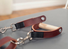 Load image into Gallery viewer, Leather and wood Pilates handles for refined grip.
