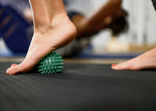 Load image into Gallery viewer, Soft-Spike Massage Ball in-use photo
