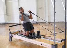 Load image into Gallery viewer, Exercising with Rialto Tower and Mat Conversion Retrofit Kit | caption::Reformer sold separately 

