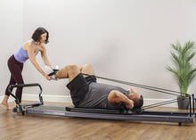 Load image into Gallery viewer, Working out on Allegro® Stretch Reformer product photo

